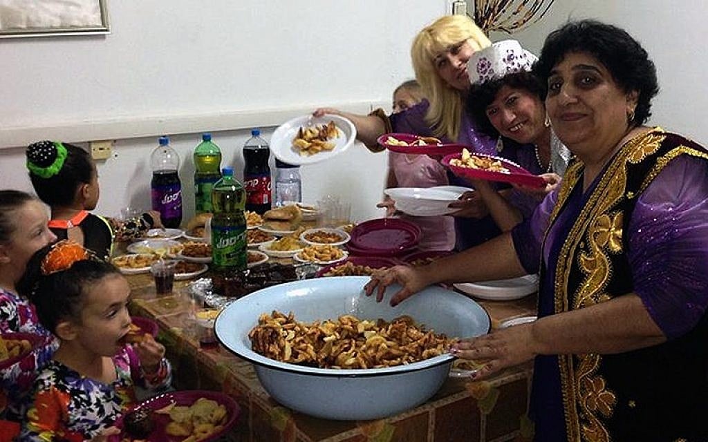 A Bukharian Jewish woman presenting her cooking at a community event in Kiryat Gat, Israel, November 3, 2014. (Courtesy of Bukharim.com/JTA) A Bukharian Jewish woman presenting her cooking at a community event in Kiryat Gat, Israel, November 3, 2014. (Courtesy of Bukharim.com/JTA)