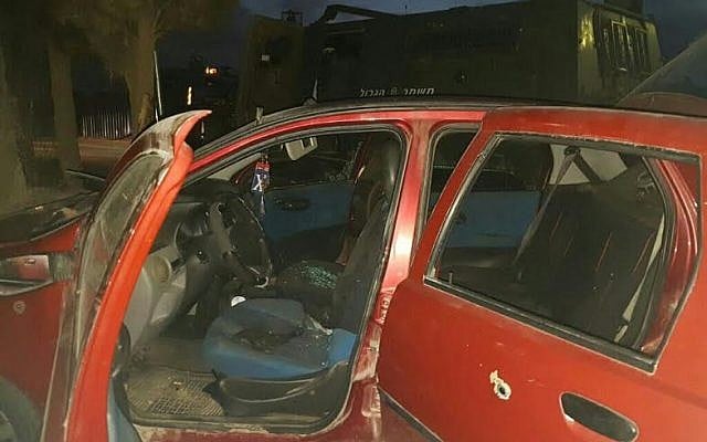A bullet hole is seen in the door of the car used to ram three border policemen on 30 october 2016 (police spokesperson)