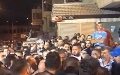 Celebrations outside the East Jerusalem home of the terrorist who murdered two Israelis October 9, 2016 (Screen capture: YouTube) Celebrations outside the East Jerusalem home of the terrorist who murdered two Israelis October 9, 2016 (Screen capture: YouTube)