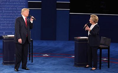Donald Trump, 2016 Republican presidential nominee, and Hillary Clinton, 2016 Democratic presidential nominee, speak during the second US presidential debate at Washington University in St. Louis, Missouri, on Sunday, Oct. 9, 2016. (Daniel Acker/Bloomberg/Getty Images, via JTA)
