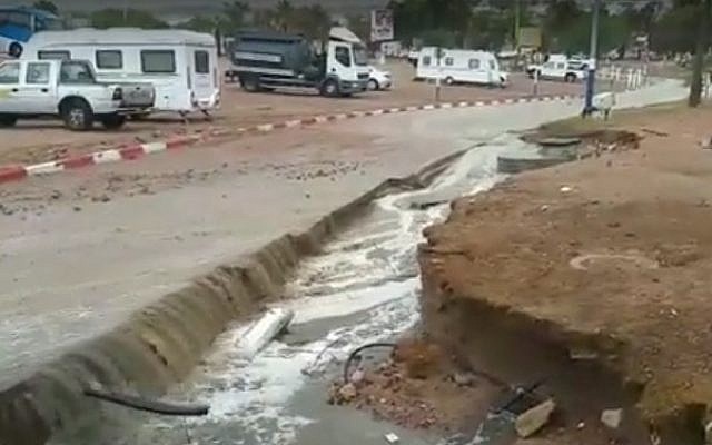 A road in Eilat that partially collapsed on October 28, 2016, following massive rainfall (screen capture: YouTube)
