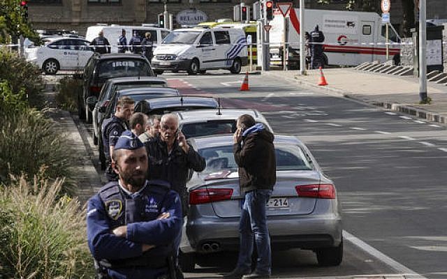 Police investigate the scene where a man stabbed two officers, in the Schaerbeek neighborhood in Brussels, Wednesday, Oct. 5, 2016. (AP Photo/Olivier Matthys) Police investigate the scene where a man stabbed two officers, in the Schaerbeek neighborhood in Brussels, Wednesday, Oct. 5, 2016. (AP Photo/Olivier Matthys)