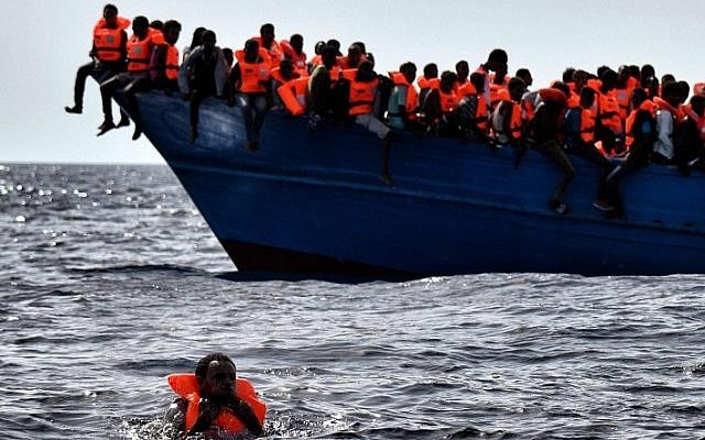 Migrants wait to be rescued as they drift in the Mediterranean Sea some 20 nautical miles north off the coast of Libya on October 3, 2016. (AFP/Aris Messinis) Migrants wait to be rescued as they drift in the Mediterranean Sea some 20 nautical miles north off the coast of Libya on October 3, 2016. (AFP/Aris Messinis)