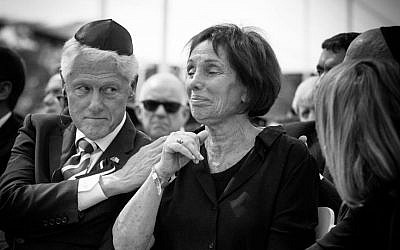Bill Clinton comforts Shimon Peres's daughter Tzvia (Elad Malka)