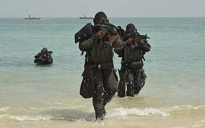 Undated photo shows the Royal Saudi Navy conducting military exercises dubbed Gulf Shield 1 in the Strait of Hormuz and the Sea of Oman. (Saudi Press Agency via AP)