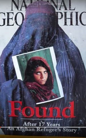 Sharbat Gula, relocated as a grown woman in a picture by SteveMcCurry published by National Geographic in April 2002. (YouTube screenshot of magazine cover)