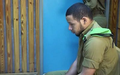 IDF soldier Fabio Sah-Kamal sits in a military court on October 5, 2016 after being convicted of accidentally killing his girlfriend (screen capture: Ynet)