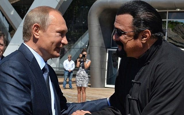 This file photo taken on September 04, 2015 shows Russian President Vladimir Putin (L) shaking hands with US action movie actor Steven Seagal in Vladivostok. (AFP PHOTO / SPUTNIK / ALEXEI DRUZHININ) This file photo taken on September 04, 2015 shows Russian President Vladimir Putin (L) shaking hands with US action movie actor Steven Seagal in Vladivostok. (AFP PHOTO / SPUTNIK / ALEXEI DRUZHININ)
