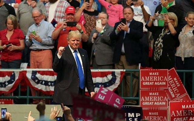 Republican presidential nominee Donald Trump gestures to the crowd during a campaign rally inside the Cabarrus Arena 7 Events Center in Concord, North Carolina. (AFP PHOTO / Logan Cyrus) Republican presidential nominee Donald Trump gestures to the crowd during a campaign rally inside the Cabarrus Arena 7 Events Center in Concord, North Carolina. (AFP PHOTO / Logan Cyrus)