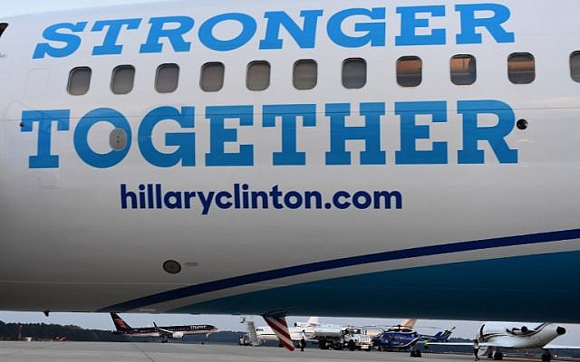 US Republican presidential nominee Donald Trump's campaign plane is seen landing near his rival US Democratic presidential nominee Hillary Clinton's plane in Morrisville, North Carolina, North Carolina, on November 3, 2016. ( AFP PHOTO / JEWEL SAMAD)