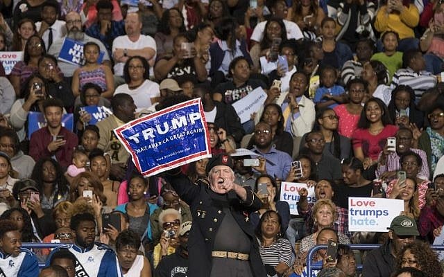 A supporter of US Republican presidential candidate Donald Trump stands up and shouts as US President Barack Obama speaks during a Hillary for America campaign event at Fayetteville State University in Fayetteville, North Carolina, November 4, 2016. (AFP/Jim Watson) A supporter of US Republican presidential candidate Donald Trump stands up and shouts as US President Barack Obama speaks during a Hillary for America campaign event at Fayetteville State University in Fayetteville, North Carolina, November 4, 2016. (AFP/Jim Watson)