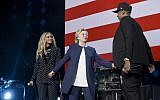 Hillary Clinton (C) stands with Beyonce (L) and Jay Z  during a Get Out the Vote (GOTV) performance in support of the Democratic presidential nominee at the Wolstein Center in Cleveland, Ohio on November 4, 2016. (AFP/Brendan Smialowski)