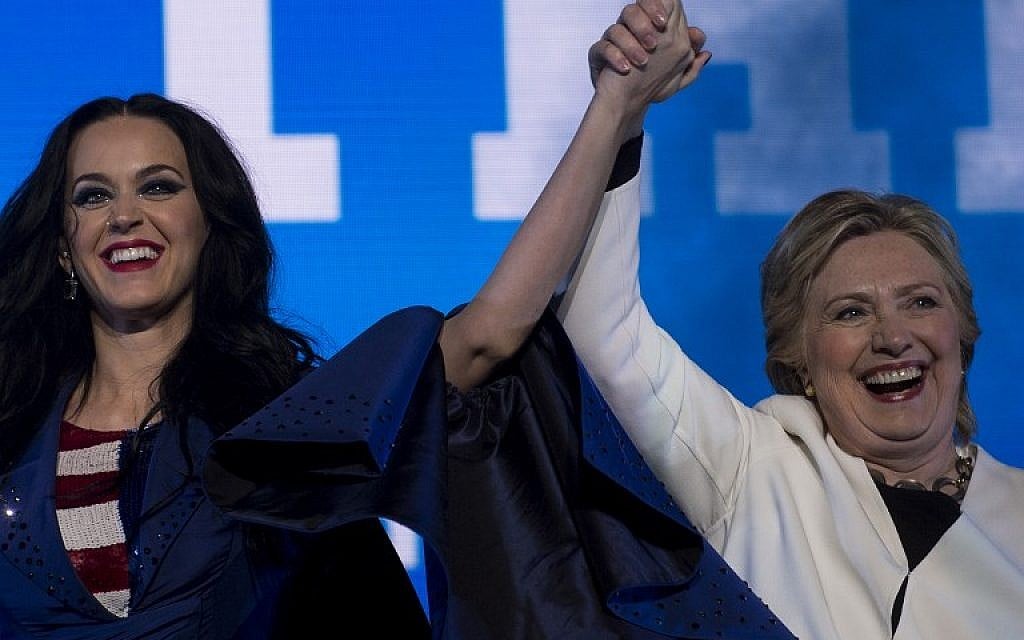 Singer Katy Perry (L) and Democratic presidential nominee Hillary Clinton cheer during a GOTV concert at the Mann Center for the Performing Arts in Philadelphia on November 5, 2016. (AFP PHOTO/Brendan Smialowski) Singer Katy Perry (L) and Democratic presidential nominee Hillary Clinton cheer during a GOTV concert at the Mann Center for the Performing Arts in Philadelphia on November 5, 2016. (AFP PHOTO/Brendan Smialowski)