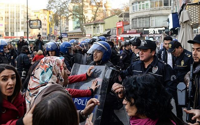 Turkish anti-riot police push away protesters at Kadikoy district in Istanbul, on November 6, 2016, during a demonstration against the arrest of nine MPs of the pro-Kurdish People's Democratic Party (HDP), including the two co-leaders. Turkey's main pro-Kurdish party on Sunday said it was pulling out of parliament after nine of its MPs including the two co-leaders were arrested in an unprecedented crackdown. (AFP PHOTO/YASIN AKGUL) Turkish anti-riot police push away protesters at Kadikoy district in Istanbul, on November 6, 2016, during a demonstration against the arrest of nine MPs of the pro-Kurdish People's Democratic Party (HDP), including the two co-leaders. Turkey's main pro-Kurdish party on Sunday said it was pulling out of parliament after nine of its MPs including the two co-leaders were arrested in an unprecedented crackdown. (AFP PHOTO/YASIN AKGUL)