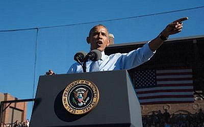 US President Barack Obama speaks at a rally for Democratic presidential nominee Hillary Clinton in Ann Arbor, Michigan, on November 7, 2016. (AFP PHOTO / NICHOLAS KAMM)