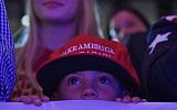 A child watches as Republican presidential nominee Donald Trump speaks during a rally at the Lackawanna College Student Union in Scranton, Pennsylvania, on November 7, 2016. (AFP PHOTO / MANDEL NGAN)