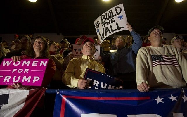 Supporters of Republican presidential nominee Donald Trump listen at a rally at Lackawanna College in Scranton, Pennsylvania, on the final day of campaigning November 7, 2016. (AFP PHOTO / DOMINICK REUTER)