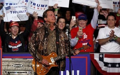 US musician Ted Nugent performs the National Anthem prior to the arrival of US Republican presidential candidate Donald Trump and running mate Mike Pence for their final campaign event of the 2016 presidential election, November 7, 2016 in Grand Rapids, Michigan. AFP PHOTO / JEFF KOWALSKY) US musician Ted Nugent performs the National Anthem prior to the arrival of US Republican presidential candidate Donald Trump and running mate Mike Pence for their final campaign event of the 2016 presidential election, November 7, 2016 in Grand Rapids, Michigan. AFP PHOTO / JEFF KOWALSKY)