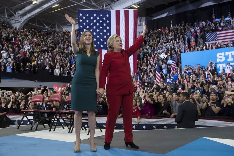 Democratic presidential nominee Hillary Clinton and her daughter Chelsea Clinton wave after a midnight rally at Reynolds Coliseum, November 8, 2016 in Morrisville, North Carolina. (Brendan Smialowski/AFP) Then Democratic presidential nominee Hillary Clinton and her daughter Chelsea Clinton wave after a midnight rally at Reynolds Coliseum, November 8, 2016 in Morrisville, North Carolina. (Brendan Smialowski/AFP)