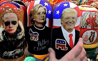 Traditional Russian wooden nesting dolls, Matryoshka dolls, depicting Russia's President Vladimir Putin, US Democratic presidential nominee Hillary Clinton and US Republican presidential nominee Donald Trump are seen on sale at a gift shop in central Moscow on November 8, 2016. (AFP PHOTO / Kirill KUDRYAVTSEV)