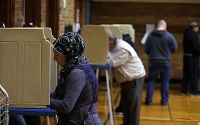 People voting at Oakman Elementary School in the US presidential election on November 8, 2016 in Dearborn, Michigan. (AFP/Jeff Kowalsky)