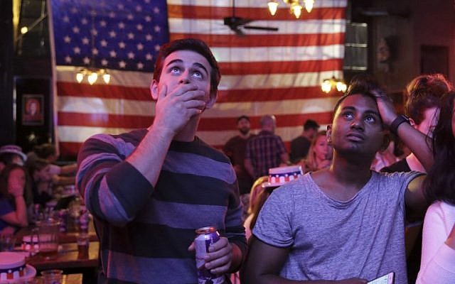 Supporters of US Democratic presidential candidate Hillary Clinton watch televised coverage of the US presidential election at Comet Tavern in the Capitol Hill neighborhood of Seattle, Washington, on November 8, 2016. (AFP/Jason Redmond)