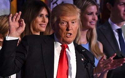 Republican presidential candidate Donald Trump flanked by members of his family speaks to supporters during election night at the New York Hilton Midtown in New York on November 9, 2016. 
Trump won the US presidency. (AFP PHOTO / Timothy A. CLARY)