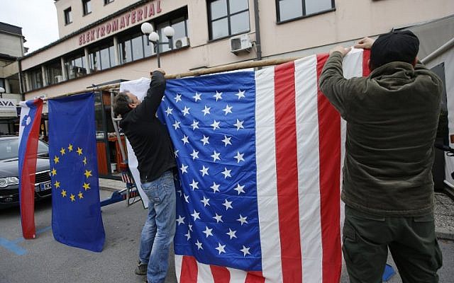Residents of Sevnica, hometown of Melania Trump, wife of Republican presidential elect Donald Trump, hang a US flag as they celebrate the victory of Donald Trump in the race for the White House in Sevnica, Slovenia, November 9, 2016. (AFP/Jure MAKOVEC) Residents of Sevnica, hometown of Melania Trump, wife of Republican presidential elect Donald Trump, hang a US flag as they celebrate the victory of Donald Trump in the race for the White House in Sevnica, Slovenia, November 9, 2016. (AFP/Jure MAKOVEC)