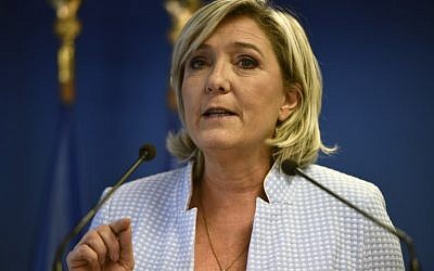 President of the French far-right party and presidential candidate for the 2017 French Presidential elections Marine Le Pen delivers a speech during a press conference on november 9, 2016 in the party headquarters in Nanterre, near Paris, following the victory by US Republican candidate Donald Trump in US presidential elections.(AFP PHOTO / Martin BUREAU)