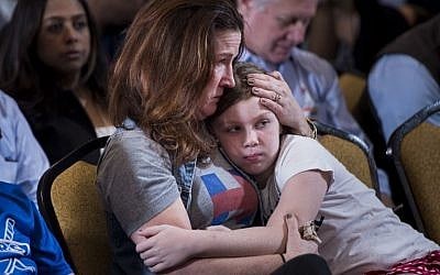 A supporter waits for former Democratic US Presidential candidate Hillary Clinton to speak at the New Yorker Hotel after her defeat to rival Republican Donald Trump last night November 9, 2016 in New York. (AFP PHOTO / Brendan Smialowski)