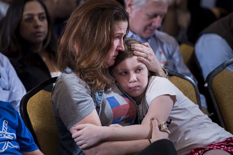 A supporter waits for former Democratic US Presidential candidate Hillary Clinton to speak at the New Yorker Hotel after her defeat to rival Republican Donald Trump last night November 9, 2016 in New York. (AFP PHOTO / Brendan Smialowski)