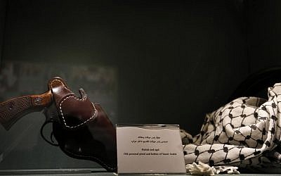 A picture taken on November 9, 2016 shows a pistol in a holster next to a Palestinian kaffiyeh in a display at the new Arafat museum in the West Bank city of Ramallah. (AFP/ABBAS MOMANI) A picture taken on November 9, 2016 shows a pistol in a holster next to a Palestinian kaffiyeh in a display at the new Arafat museum in the West Bank city of Ramallah. (AFP/ABBAS MOMANI)