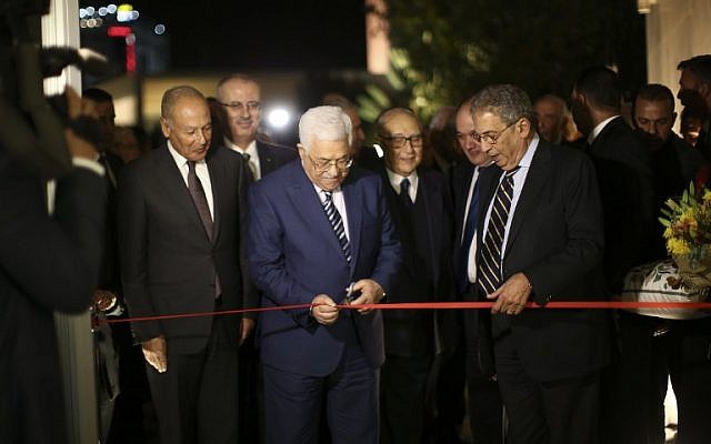 Ahmed Aboul Gheit, Secretary-General of the Arab League (L), Palestinian president Mahmud Abbas (C) and former Secretary-General of the Arab League Amr Mousa cut the ribbon during the inauguration ceremony of late Palestinian leader Yasser Arafat's Museum in the West Bank city of Ramallah on November 9, 2016. (AFP PHOTO/Fadi Arouri)