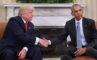 US President Barack Obama and President-elect Donald Trump shake hands during a transition planning meeting in the Oval Office at the White House on November 10, 2016, in Washington,DC. (JIM WATSON/AFP)