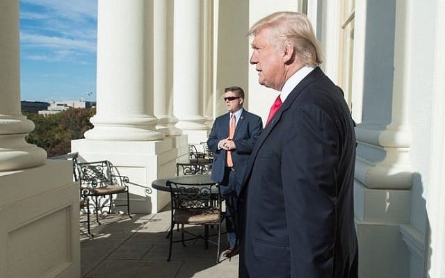 US President-elect Donald Trump walks onto a balcony at the US Capitol in Washington, DC, on November 10, 2016. (AFP/Nicholas Kamm) US President-elect Donald Trump walks onto a balcony at the US Capitol in Washington, DC, on November 10, 2016. (AFP/Nicholas Kamm)