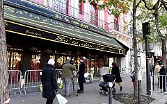 People walk in front of the Bataclan concert hall in Paris on November 11, 2016. (AFP/Miguel Medina)