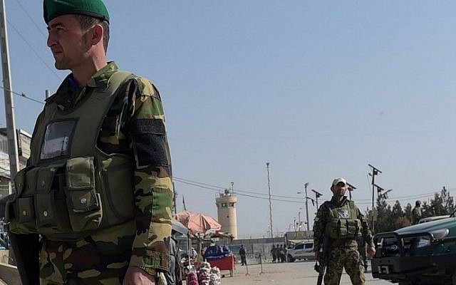 Afghan security personnel keep watch near the largest US military base in Bagram, 50 km north of Kabul, after an explosion on November 12, 2016. (AFP PHOTO / SHAH MARAI)