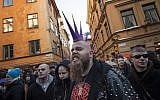 A counter-protester is arrested by the police as they keep them away from the neo-Nazi Nordic Resistance Movement's sympathizers after a demonstration in central Stockholm on November 12, 2016. (AFP Photo/Jonathan Nackstrand)