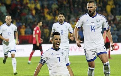 Israel's Eran Zahavi (center) celebrates after scoring a goal during the World Cup 2018 qualifier football match Albania versus Israel at the Elbasan Arena stadium in Elbasan on November 12, 2016.  (AFP PHOTO / GENT SHKULLAKU)