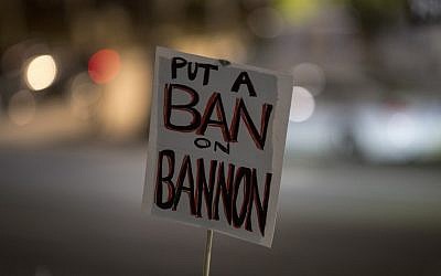 A protest sign is held in the air at a protest against the appointment of white nationalist alt-right media mogul, former Breitbart News head Stephen Bannon, to be chief strategist of the White House by president-elect Donald Trump, near City Hall in Los Angeles, November 16, 2016. (AFP/DAVID MCNEW) A protest sign is held in the air at a protest against the appointment of white nationalist alt-right media mogul, former Breitbart News head Stephen Bannon, to be chief strategist of the White House by president-elect Donald Trump, near City Hall in Los Angeles, November 16, 2016. (AFP/DAVID MCNEW)