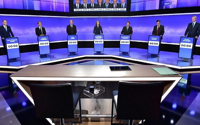 Candidates for France's right-wing party primaries prepare to take part in a televised debate on November 17, 2016. From left: Member of Parliament Jean-Francois Cope; former president Nicolas Sarkozy; former prime minister and Bordeaux mayor Alain Juppe; Member of Parliament Nathalie Kosciusko-Morizet; head of the French Christian Democratic Party Jean-Frederic Poisson; former prime minister and Member of the Parliament Francois Fillon; and former agriculture minister Bruno Le Maire. (AFP/Pool/Christophe Archambault)