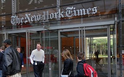 People walking past the west entrance of the New York Times building at 620 Eighth Avenue in New York, April 27, 2016. (AFP/Don Emmert)