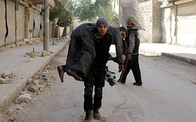 A Syrian civil defense volunteer, known as the White Helmets, carries an injured man on November 19, 2016 following a reported air strike on Aleppo's rebel-held neighbourhood of Bab al-Nayrab. (AFP PHOTO/AMEER ALHALBI) A Syrian civil defense volunteer, known as the White Helmets, carries an injured man on November 19, 2016 following a reported air strike on Aleppo's rebel-held neighbourhood of Bab al-Nayrab. (AFP PHOTO/AMEER ALHALBI)