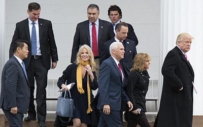 US President-elect Donald Trump(R) and Vice President-elect Mike Pence(2nd-R) leave the Lamington Presbyterian Church after Sunday services in Bedminster, New Jersey November 20, 2016. (AFP PHOTO / DON EMMERT)