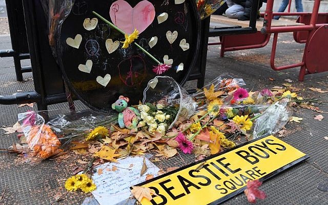 Activists protest racism and hate after swastikas found in Adam Yauch Park in Brooklyn, New York on November 20, 2016.(AFP PHOTO / ANGELA WEISS)