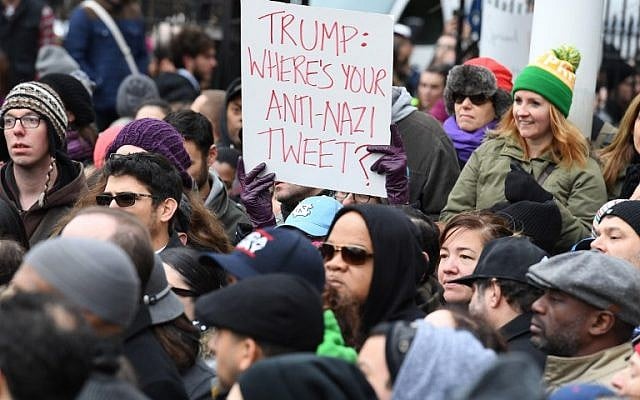 Activists protest racism and hate, after swastikas were found in Adam Yauch Park in Brooklyn, New York, on November 20, 2016.(AFP PHOTO / ANGELA WEISS) Activists protest racism and hate, after swastikas were found in Adam Yauch Park in Brooklyn, New York, on November 20, 2016.(AFP PHOTO / ANGELA WEISS)