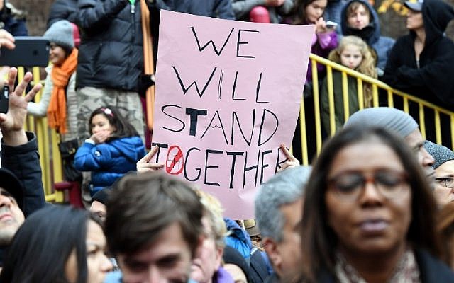 Activists protest racism and hate after swastikas were found in Adam Yauch Park in Brooklyn, New York on November 20, 2016. (AFP PHOTO / ANGELA WEISS)