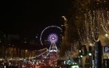 A photo taken on November 21, 2016 shows La Grande Roue ferris wheel in Paris after the Christmas lights of the Champs Elysees avenue were officially switched on during a ceremony. (AFP PHOTO / GEOFFROY VAN DER HASSELT)