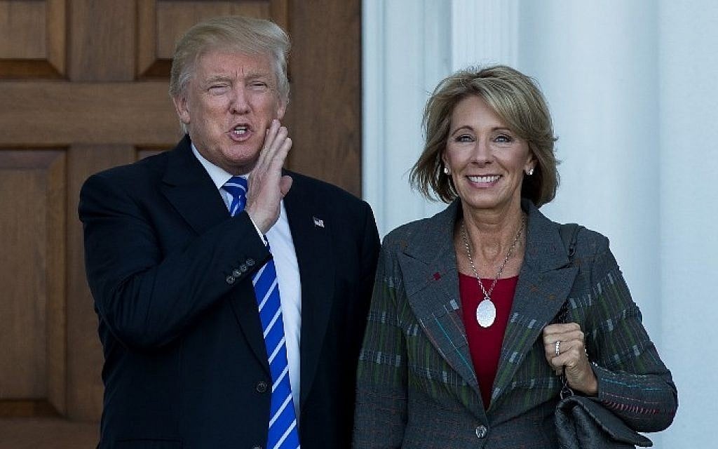 President-elect Donald Trump and Betsy DeVos after their November 18, 2016 meeting at Trump International Golf Club, in Bedminster Township, New Jersey. (AFP PHOTO / GETTY IMAGES NORTH AMERICA / Drew Angerer) President-elect Donald Trump and Betsy DeVos after their November 18, 2016 meeting at Trump International Golf Club, in Bedminster Township, New Jersey. (AFP PHOTO / GETTY IMAGES NORTH AMERICA / Drew Angerer)