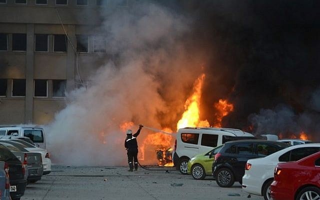 A fireman tries to extinguish burning cars cars after an explosion on November 24, 2016 in Adana, Turkey, in which two people were killed and 16 wounded. (AFP PHOTO/IHLAS NEWS AGENCY) A fireman tries to extinguish burning cars cars after an explosion on November 24, 2016 in Adana, Turkey, in which two people were killed and 16 wounded. (AFP PHOTO/IHLAS NEWS AGENCY)